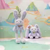 Jinnew Original Nuevo Estilo Chino Divertido Colgante de Peluche de Conejo Desplegable Llavero de Conejo de Orejas Tirables Muñeca Venta al por Mayor
