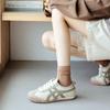 2023 otoño nuevos calcetines de mujer al por mayor color sólido dopamina media pantorrilla calcetines de algodón sueltos sentido moda calcetines de moda para mujer