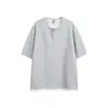 Yidao Vintage 2026 Verano Nuevo Estilo Retro Americano Diseño de Retazos Falso de Dos Piezas Corte Holgado Cuello Henley de Pareja Manga Corta