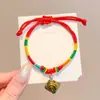 Pulseira de corda colorida zongzi do Festival do Barco-Dragão 2026 novo modelo pulseira trançada artesanal étnica infantil atacado corda vermelha