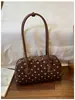 Bolsa de almofada de bolinhas de alta qualidade e estilosa para mulheres, nova bolsa de boliche retrô de nicho, bolsa de ombro sob o braço, moderna
