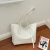 Bolso de mano texturizado estilo coreano al por mayor para mujer, nuevo modelo de verano 2026, bolso de hombro simple de color liso, bolso de axila para el día a día