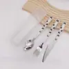 Venta al por mayor de fábrica creativa de dibujos animados para niños juego de cubiertos de tres piezas de acero inoxidable tenedor cuchillo cuchara juego de cubiertos portátil