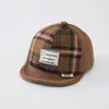Al por mayor Otoño 2026 Lana Cálida Gorra de Pato para Bebé Estilo Coreano Serie a Cuadros para Niños y Niñas Sombrero de Ala Suave de Moda para Bebé