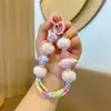 Corrente de pingente de bola de pelo com contas para celular atacado avião pintado à mão desenho animado bolsa chaveiro chaveiro de apertar pequeno presente