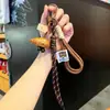 Miu Wind Agua Alcalina Pan Llavero Otoño e Invierno Maillard Lindo Colgante de Pan Pareja Estudiante Decoración de Mochila Escolar