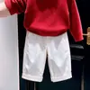 Conjunto de dos piezas para niño estilo coreano otoño e invierno 2026: suéter de punto suave rojo con cuello de solapa y pantalones blancos de pierna ancha para niños
