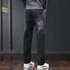 Jeans para hombre 2026 nueva marca de moda talla grande sueltos rectos largos elásticos versátiles pantalones casuales ropa de hombre