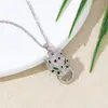 Colgante de Cabeza de Leopardo con Ojos Verdes Incrustado de Circonita de Cobre Nuevo Hip-Hop Transfronterizo Europeo y Americano Joyería de Nicho Venta al por Mayor Recomendado por Xiaohongshu