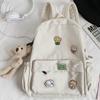 Nova Mochila Escolar 2026 para Mulheres, Versão Coreana, Estilo Harajuku, Mochila de Lona Versátil com Desenhos para Alunos do Ensino Fundamental II e Médio