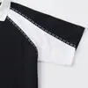 Moda casual para uso diario, estilo retro deportivo primavera/verano, camisa polo de manga corta con retazos en blanco y negro, mangas raglán acanaladas y corte holgado