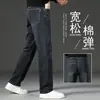 Jeans masculinos de alta qualidade 2026, corte reto solto, primavera e outono, lavado, versátil, elástico, calça comprida casual para homens