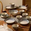 Conjunto de tigela e prato estilo japonês para uso doméstico, novo modelo 2026 de louças com cor sob esmalte, conjunto de tigela e prato para presente de inauguração