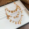Conjunto de Collar de Tres Piezas con Borla Redonda Plisada Transfronterizo Europeo y Americano, Cadena para Clavícula de Nicho de Lujo Ligero, Joyería Elegante para Mujeres con un Toque de Alta Gama