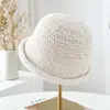 Sombrero de pescador hueco de punto de color liso estilo japonés para mujer, moda versátil de otoño e invierno 2026, sombrero tipo cubo cálido con borde enrollado