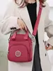 Bolso Pequeño de Lona para Mujer 2026 Verano Nuevo Estilo Mini Bolso de Hombro Casual Exquisito Multibolsillos Bolso Cruzado de Tela Oxford