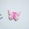 Serie de mariposas de colores con emulación de caras brillantes de dibujos animados, accesorios de resina para hacer tú mismo, horquillas para el pelo, carcasas para teléfono móvil, joyas, pegatinas para refrigerador
