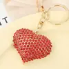 Venta caliente llavero colgante de amor con diamantes completos adornos para bolso exquisitos pequeños regalos joyería colgante de personalidad para coche venta al por mayor
