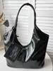 Bolso nuevo de principios de otoño 2026, bolso cubo liso vintage, bolso de mano simple, bolso de hombro a la axila moderno y relajado