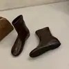 Botas de couro super macias, aumento de 3 cm na altura interna, bico redondo, efeito emagrecedor, elástico, sola reta, novo estilo 2026, botas de cano médio, botas de cano alto