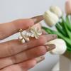 Aretes de flor de piedra ojo de gato de doble cara para mujer, aretes exquisitos versátiles de alta gama de lujo ligero, temperamento suave, aretes explosivos