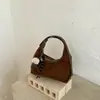 Bolso de mano informal transfronterizo, bolso de hombro, bolso cruzado, nuevo estilo vintage otoño 2026, gran capacidad, elegante, para el trabajo, tipo bolsa de albóndiga