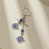 Llavero con diseño de ojo azul y diamante transfronterizo, colgante de mariposa y elefante étnico vintage, accesorios con diseño de ojo del diablo.
