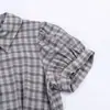 Atacado de Vestido Curto Feminino Transfronteiriço Europeu e Americano, Nova Decoração Xadrez, Vestido em Camadas com Design Estiloso e Moderno