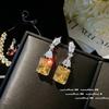 Anillo de gemas amarillas de Cenicienta Twilight, pendientes de circonita cuadrada roja granada chapados en oro brillante de 18 quilates.