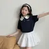 Conjunto de Verano para Niñas 2026 Nueva Moda Estilo Coreano para Niñas Mayores, Conjunto de Falda de Pastel de Manga Corta con Cuello Polo Tendencia