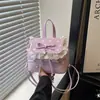 Bolsa de mão feminina estilo coreano 2026 novo design de nicho estilosa e única mochila simples