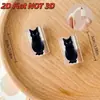 [Protector de cable de datos impreso en 2D con diseño de gato negro, previniendo la rotura del cable]; imagen de un gato negro pequeño sacando la lengua.]