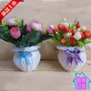 El mejor almacenamiento mimbre sintético suministro jarrón redondo blanco macetero pequeño cesta de flores