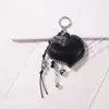 Colgante de bolsa estilo miu, colgante de corazón vintage transfronterizo, llavero de cuero hecho a mano de lujo ligero con decoración de cuerda tejida