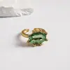 Anillo abierto geométrico floral ovalado con incrustaciones de diamantes, estilo europeo y americano, lujo ligero, un diseño de nicho y de alta gama para el dedo índice, una pieza de joyería única