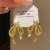 Pendientes de Encaje con Lazo y Corazón de Zirconia Aguja Plateada Lujo Ligero Moda Coreana Estilo de Alta Gama Pendientes de Personalidad de Nicho