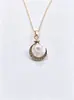 Collar de perlas de estrella y luna transfronterizo para mujer, con un diseño único con colgantes de luna y estrella adornados con diamantes, creando una cadena de clavícula delicada y elegante