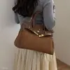 Nuevo modelo Otoño 2026, lujo ligero, elegante, bolso de mano para uso diario, bolso tipo Kelly para mujer de oficina, bolso de hombro