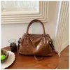 Bolsa Tote de Inverno 2025 Bolsa de Grande Capacidade Bolsa de Ombro Única Nicho Feminina Alta Aparência Simples Casual Bolsa de Axila Feminina