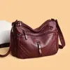 Bolso de mano retro de cuero PU suave transfronterizo para mujer, nuevo bolso de moda 2026 de gran capacidad con múltiples compartimentos, bolso cruzado casual