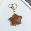 Novo Chaveiro de Estrela Pu Fofo da Huayang com Rosto Sorridente, Acessório de Roupa e Bolsa de Couro Macio e Adorável em Forma de Estrela de Cinco Pontas