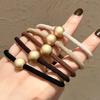 Estilo coreano nueva bola de metal texturizado oro mate marrón leche banda para el cabello moderna elegante simple goma para el cabello cuerda para el cabello accesorios para el cabello