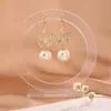 Pendientes de Gancho de Mariposa de Zirconia de Gama Alta Lujo Ligero Vintage Perla Hueca Elegantes Elegantes Versátiles Pendientes de Industria Pesada para Mujer