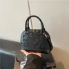 Bolsa de Ombro Nova Moda Verão 2026 Cor Sólida Tendência Bolsa Transversal Design de Nicho Retrô Bolsa Concha para Mulheres