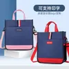 Al por mayor de fábrica mochila para clase de maquillaje con logo impreso bolsa de mensajero con correa para el hombro para clase de tutoría extracurricular estudiantil bolsa escolar portátil de doble propósito