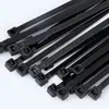Fabricantes de bridas de nailon, bridas de plástico autoblocantes con correas enrolladas autoblocantes negras con bridas blancas al por mayor
