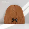 Chapéus de Outono e Inverno Coreanos para Mulheres, Chapéus de Tricô com Laço, Pequenos Chapéus de Lã, Exportação Transfronteiriça Chapéus Quentes de Pulôver para Frio, Modernos