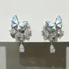 """Mariposa de Amor en un Sueño" es un Conjunto de Pendientes de Mariposa Azul Crema de Perlas Artificiales que Son Perfectos para el Verano, con Accesorios de Pendientes de Borla Súper de Hada"""