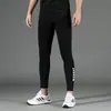 Atacado de fábrica fornecedora roupa de ginástica masculina leggings de alta elasticidade justos slim respiráveis de secagem rápida para corrida treinamento calças de compressão