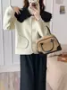 Primavera 2025 Novo Cardigan de Tricô Gola Boneca Dupla Face Tolen Estilo Chanel Solto Suéter Casaco Suavizante de Idade Macio e Aconchegante para Mulheres